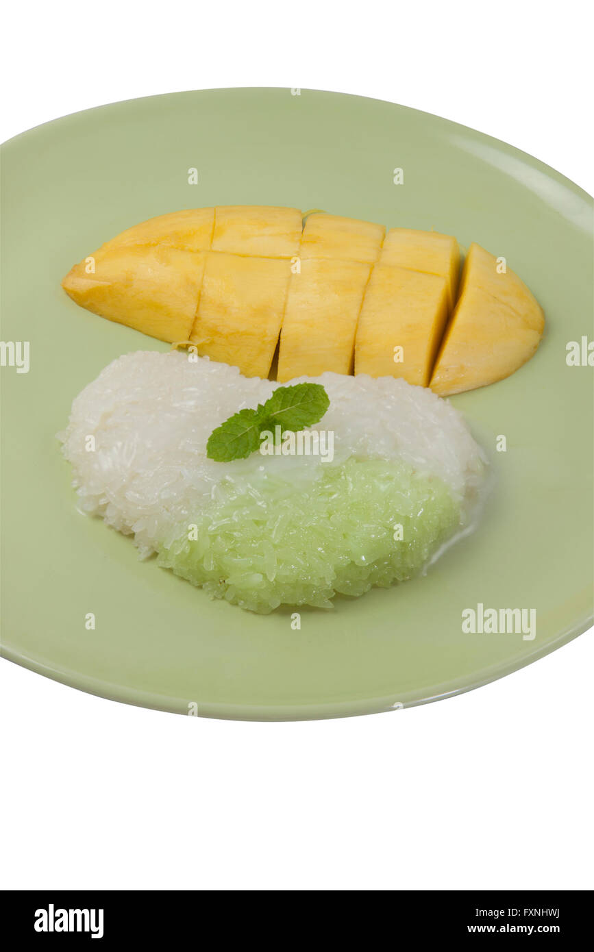 Sticky rice cooked in sweetened thick coconut milk, served with slices of ripe mango. Thai Dessert Sweet. Stock Photo