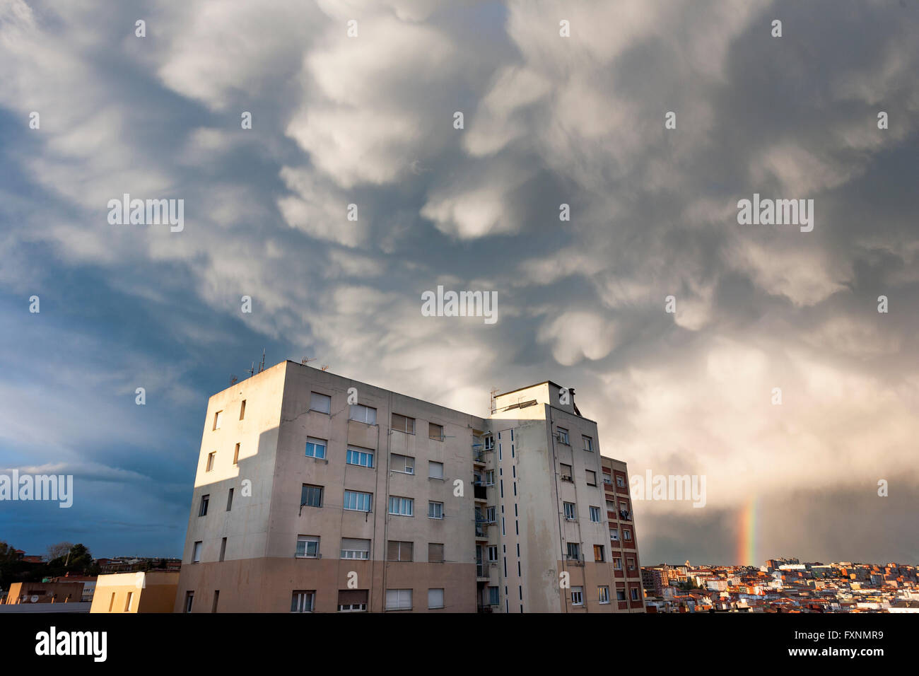 STORMY SKY WITH BIG CLOUDS AND A RAINBOW Stock Photo - Alamy
