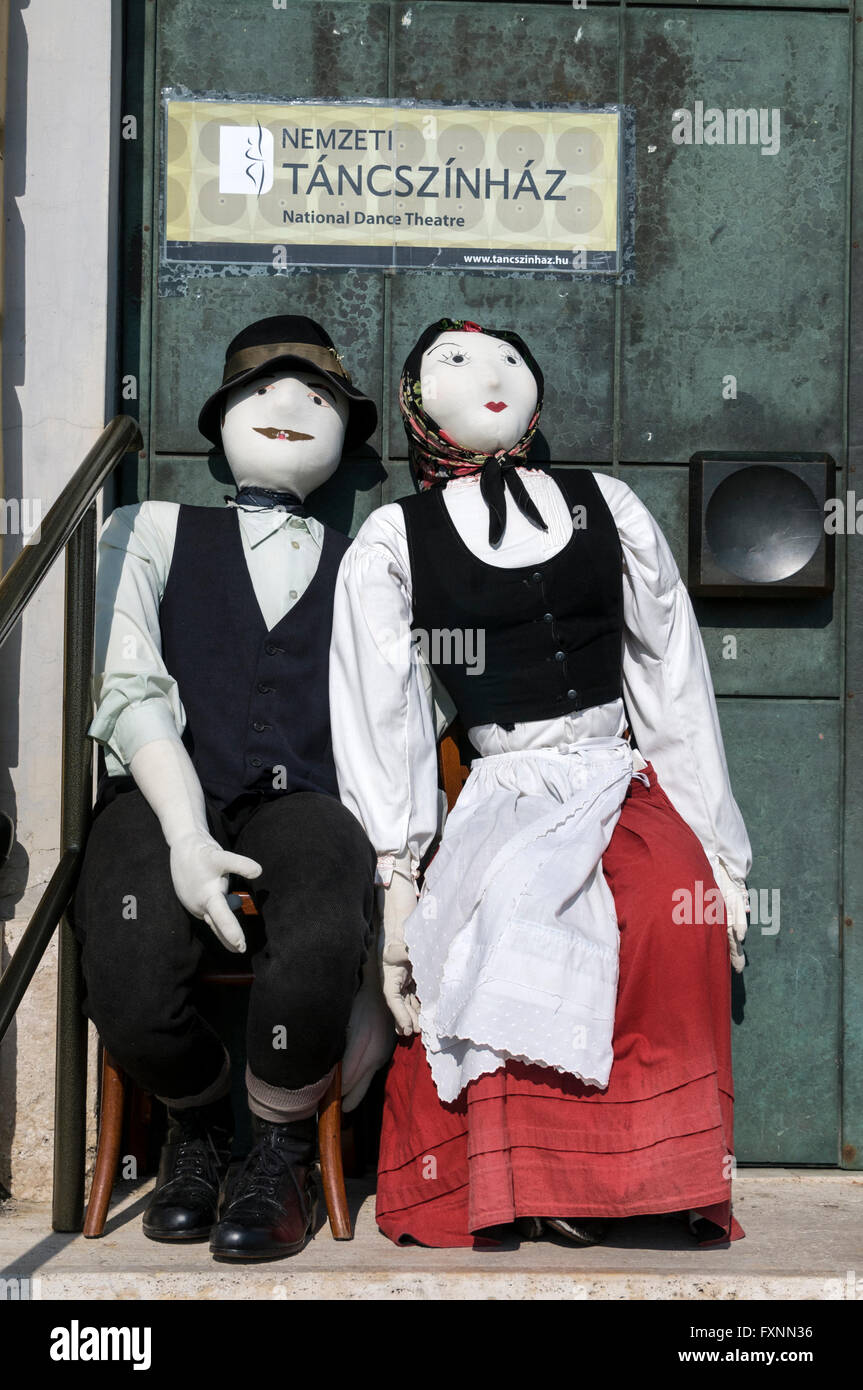 Two Hungarian dressed dummies outside the National Dance Theatre on Castle Hill in Budapest, Hungary.  Buda Castle Hill is a des Stock Photo