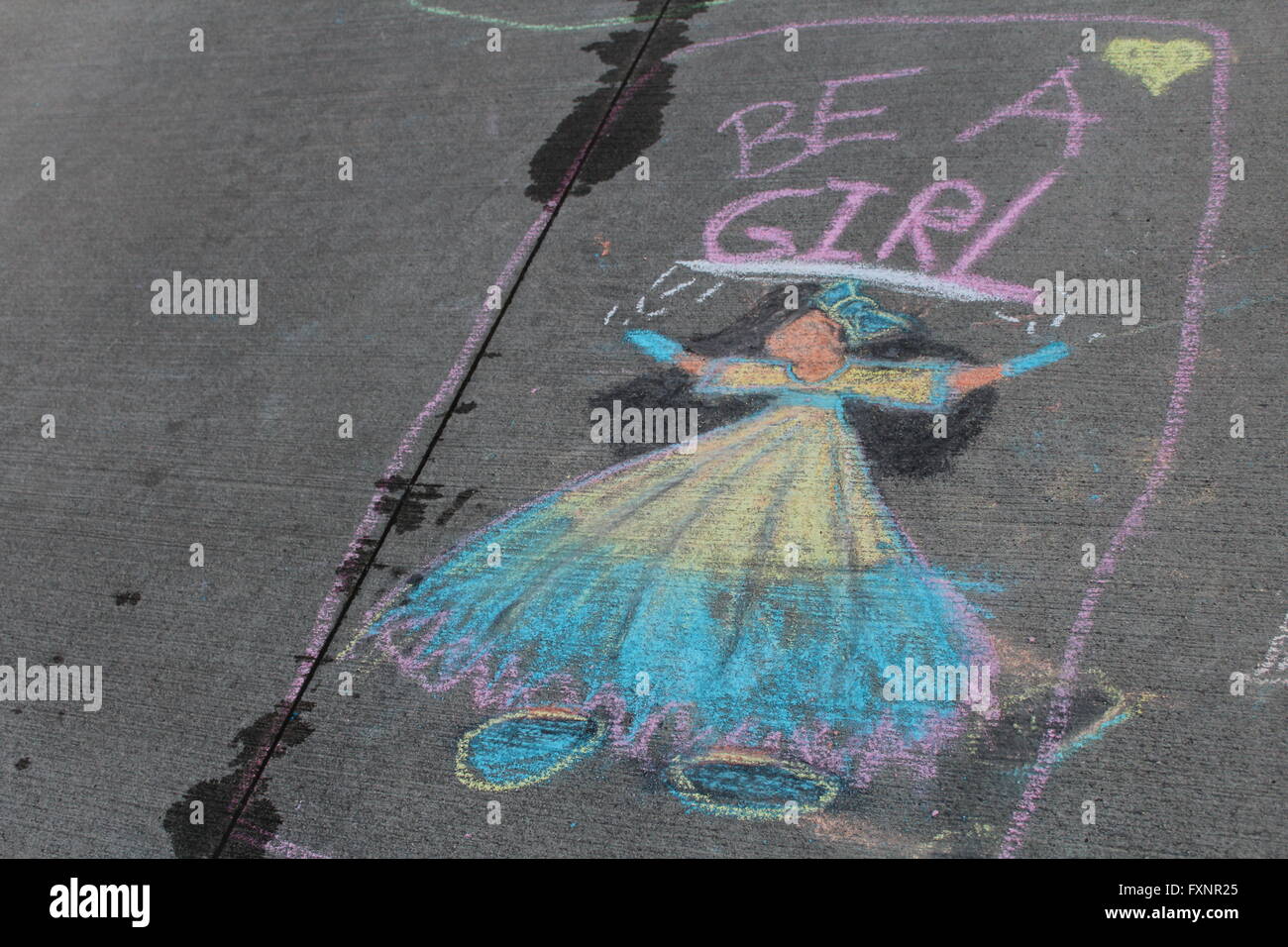 chalk drawing of girl on sidewalk Stock Photo - Alamy