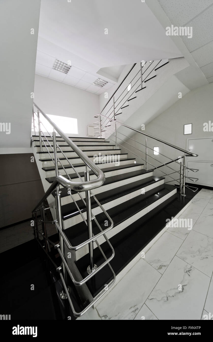 Marble staircase with a steel handrail in a modern building Stock Photo ...
