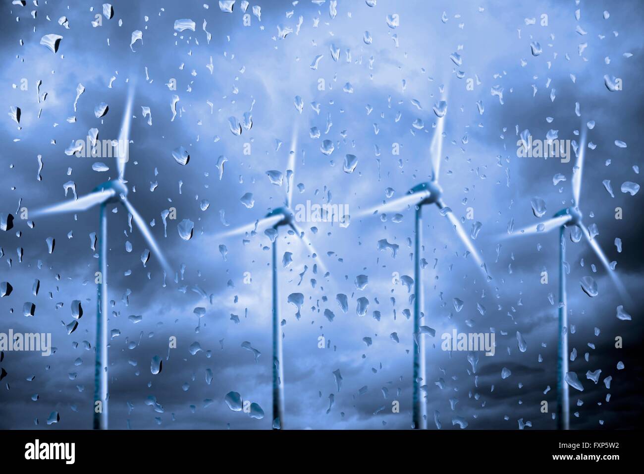 Wind turbines in the rain. Stock Photo