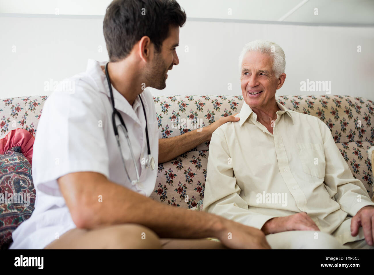 Nurse sitting senior man hi-res stock photography and images - Alamy