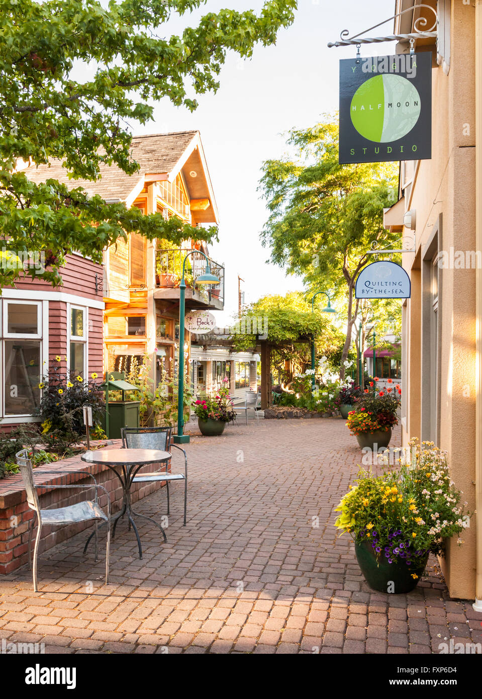 Local small business line a picturesque cobblestone shopping area in the waterfront village of Langley on Whidbey Island, Washington State, USA Stock Photo