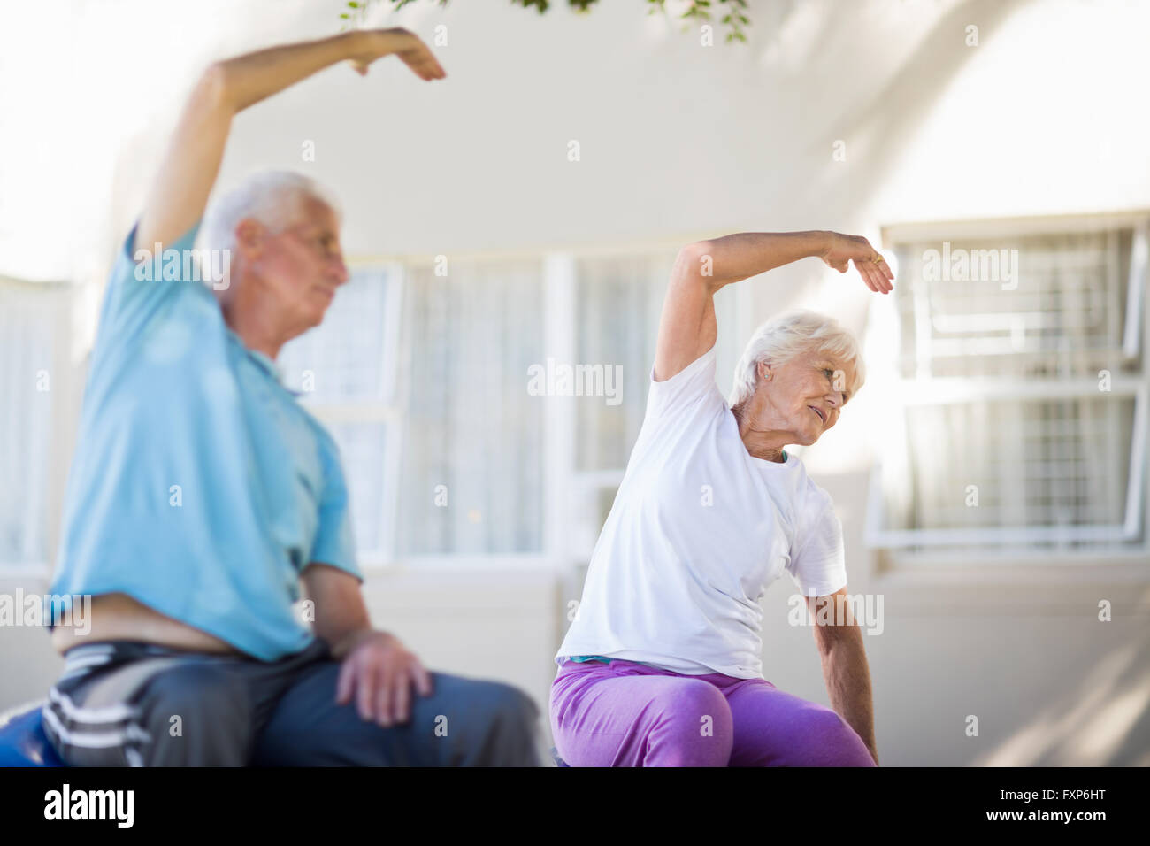 Senior couple doing exercises Stock Photo - Alamy