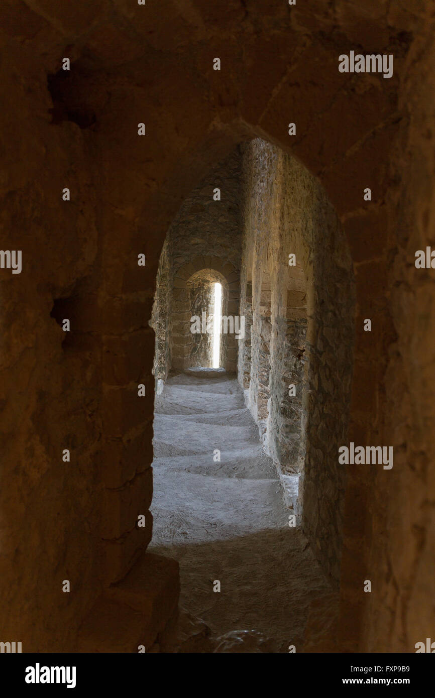 Atmospheric view inside a medieval castle corridor with daylight entering in onedirection and sideways Stock Photo