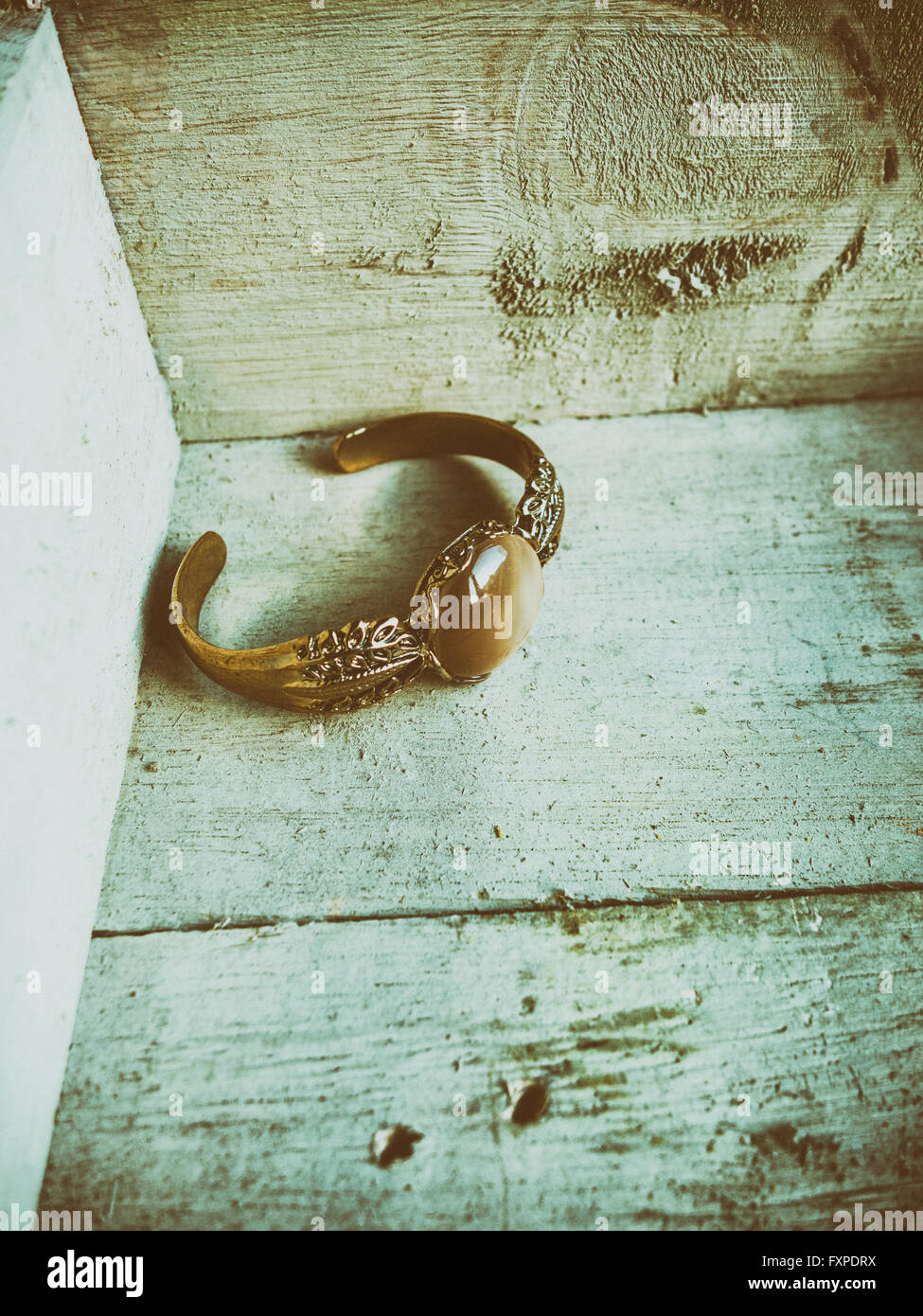 Old golden bracelet in a wooden box Stock Photo