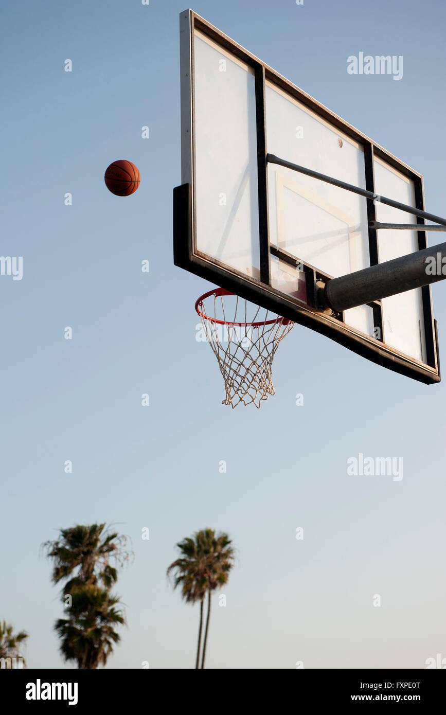 Basketball being thrown toward basketball hoop Stock Photo Alamy