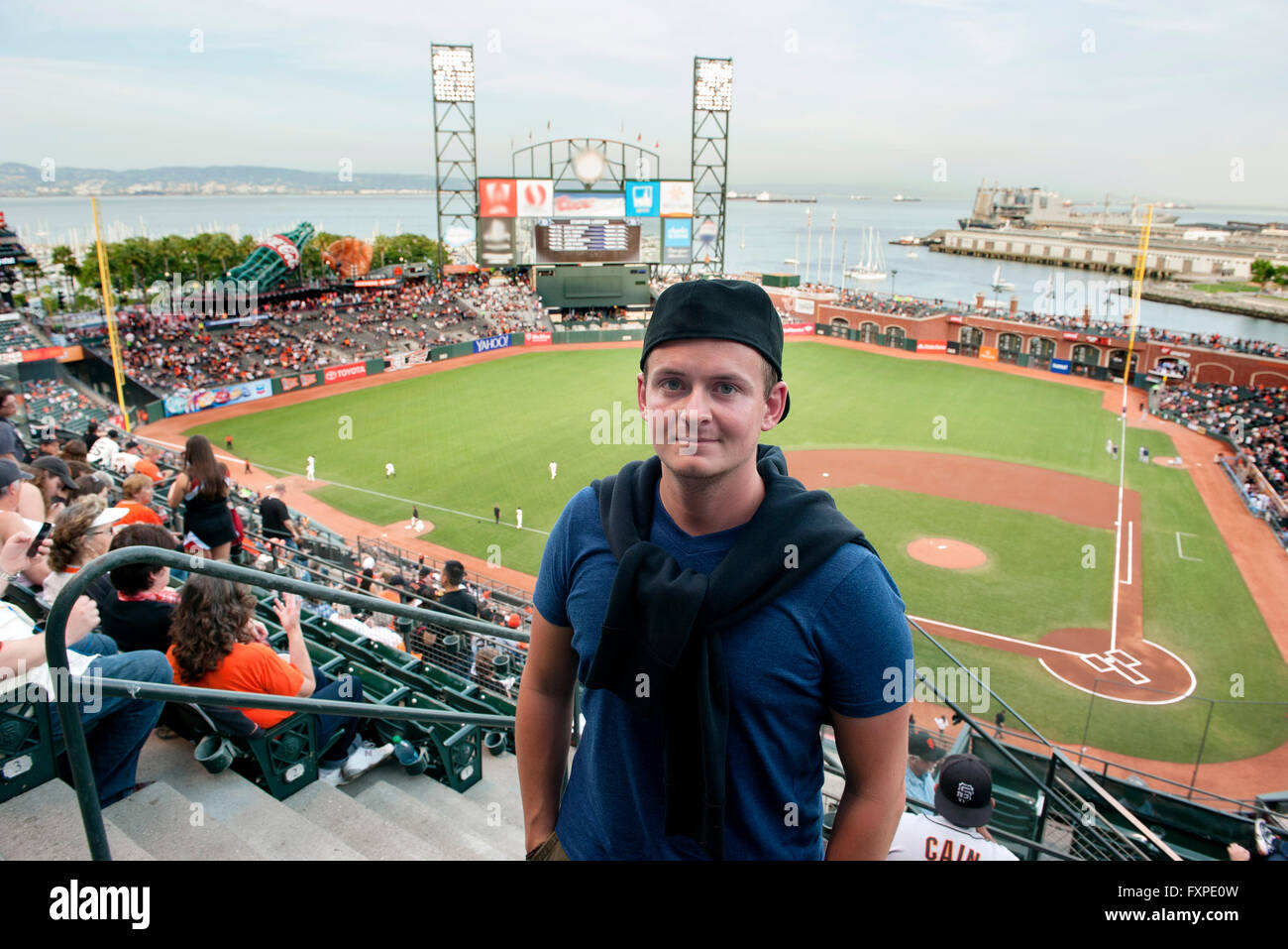 Man standing in baseball stadium in San Francisco, California, USA Stock Photo