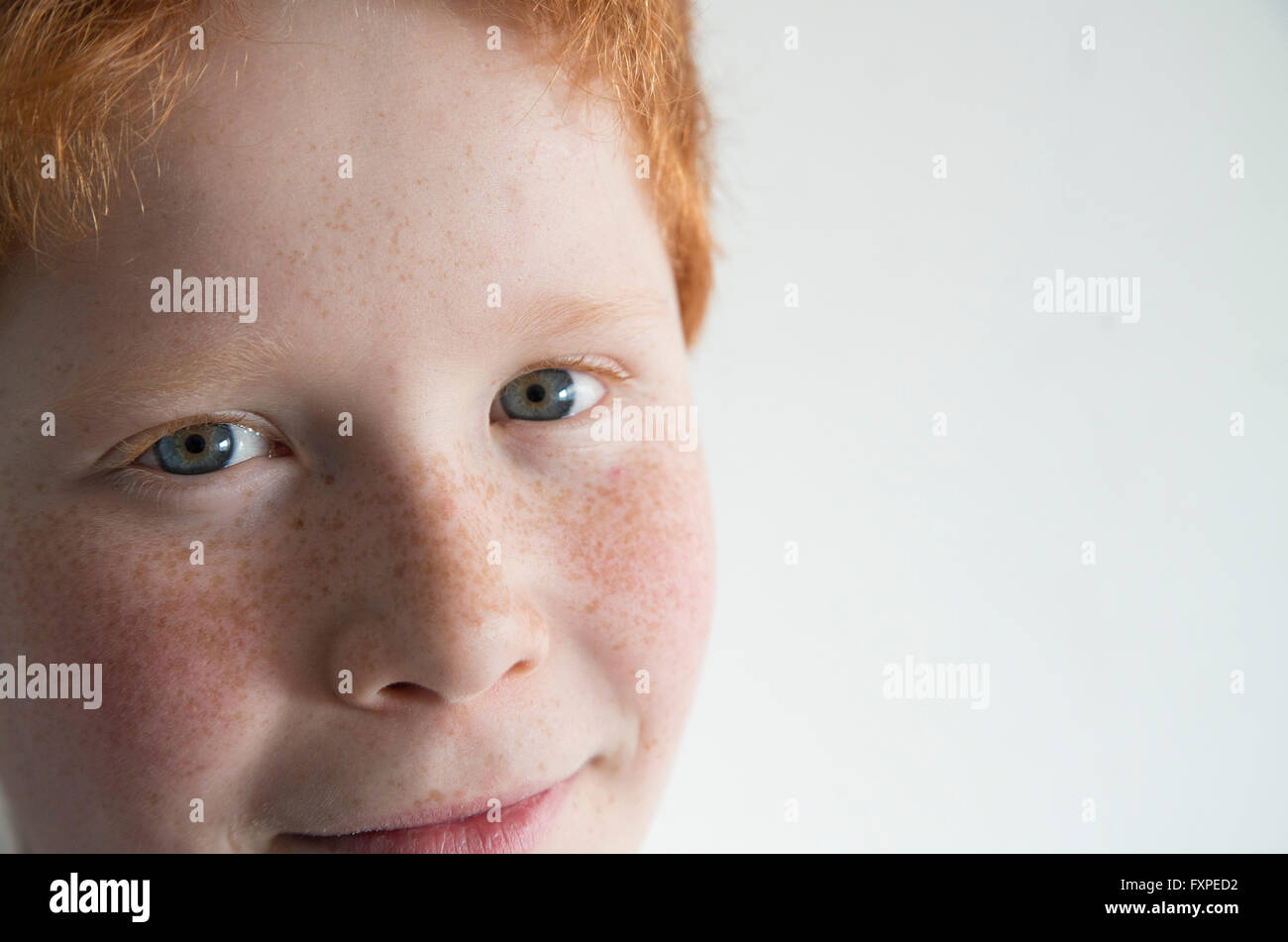 Boy with red hair and freckles, close-up portrait Stock Photo