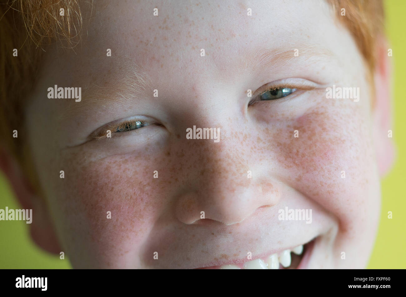 Boy smiling cheerfully, portrait Stock Photo