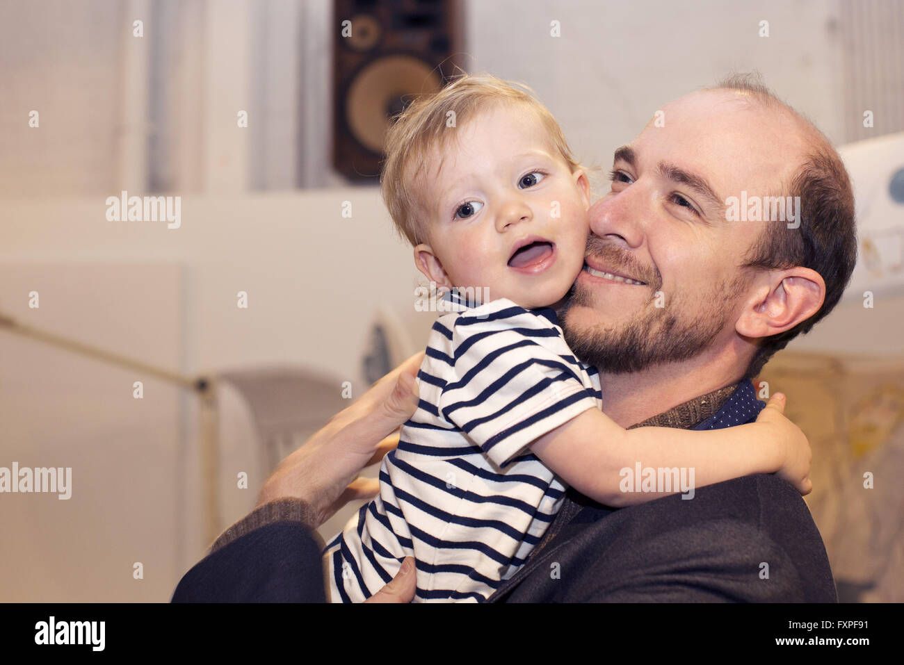 Toddler hugging father Stock Photo
