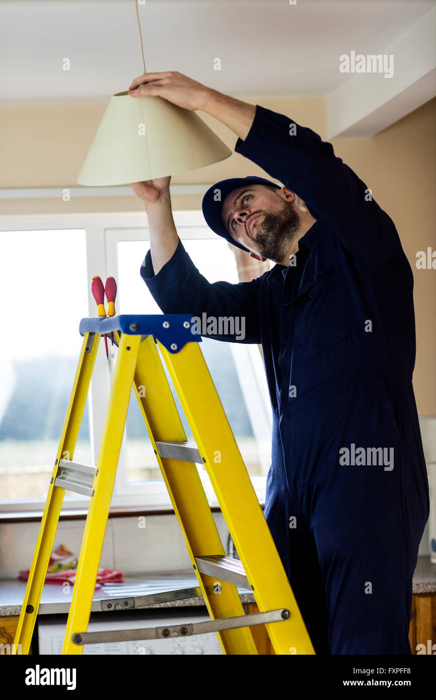 Electrician repairing ceiling lamp hi-res stock photography and images -  Alamy
