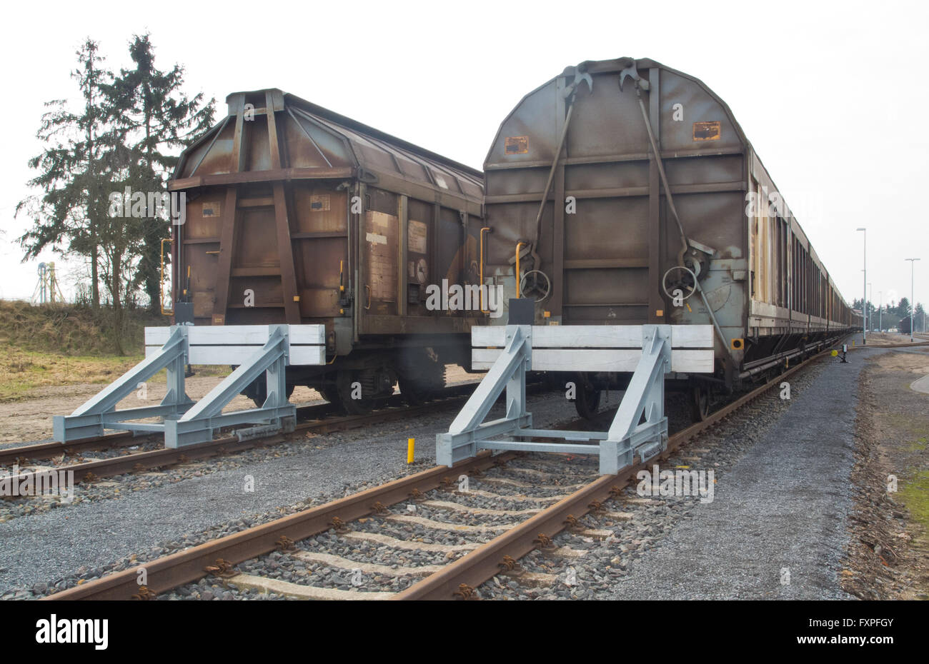 Covered goods wagons on sidings with buffer stops Stock Photo