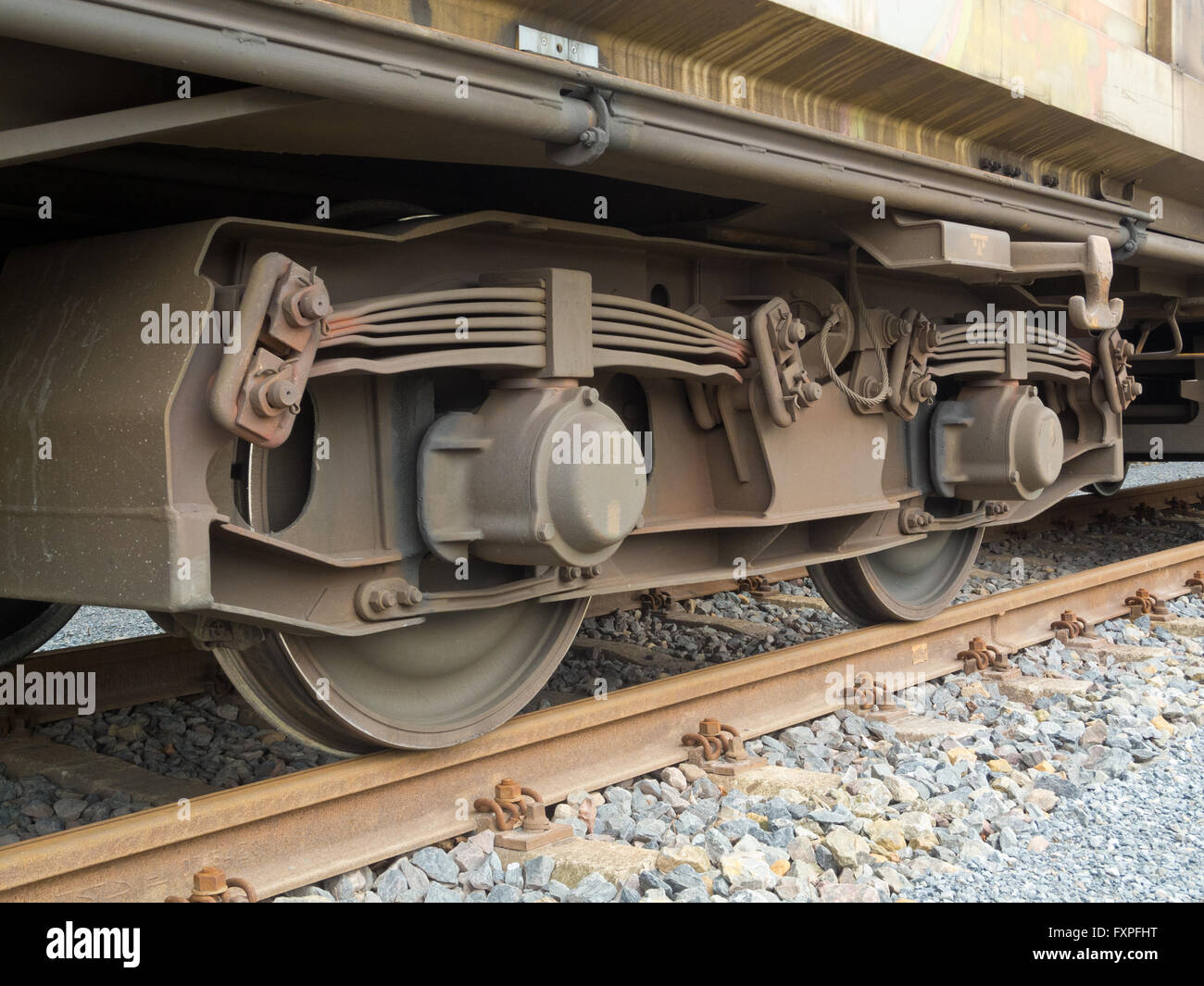 Bogie of a freight wagon with frame, leaf springs, wheels and axle bearings Stock Photo