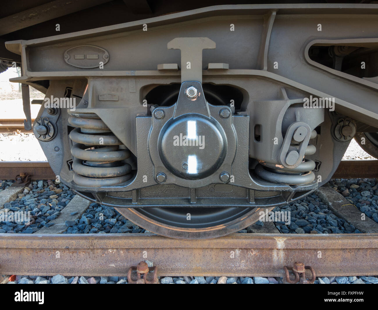Bogie of a freight wagon with frame, coil springs, wheels and axle bearings Stock Photo
