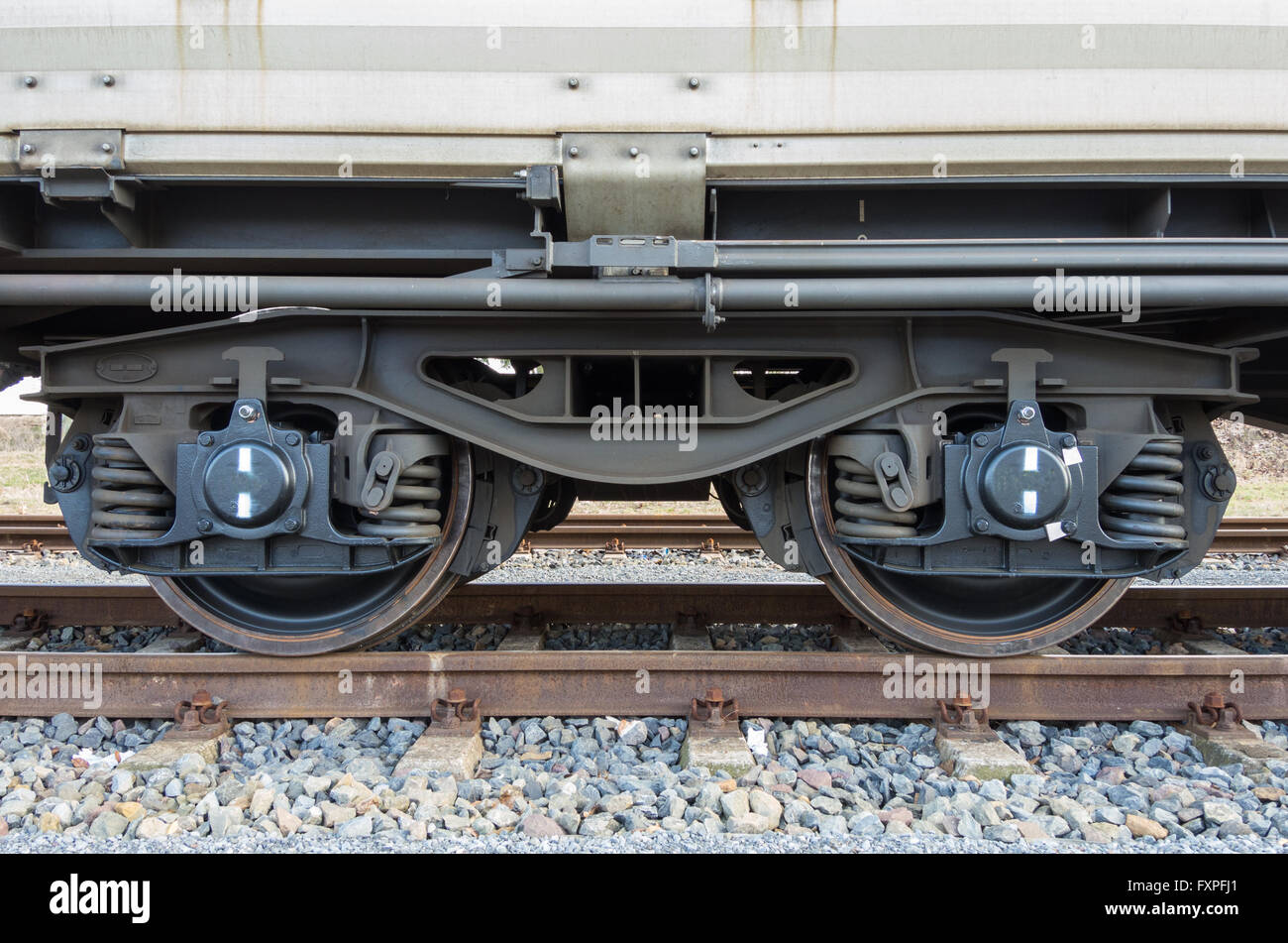 Bogie of a freight wagon with frame, coil springs, wheels and axle bearings Stock Photo