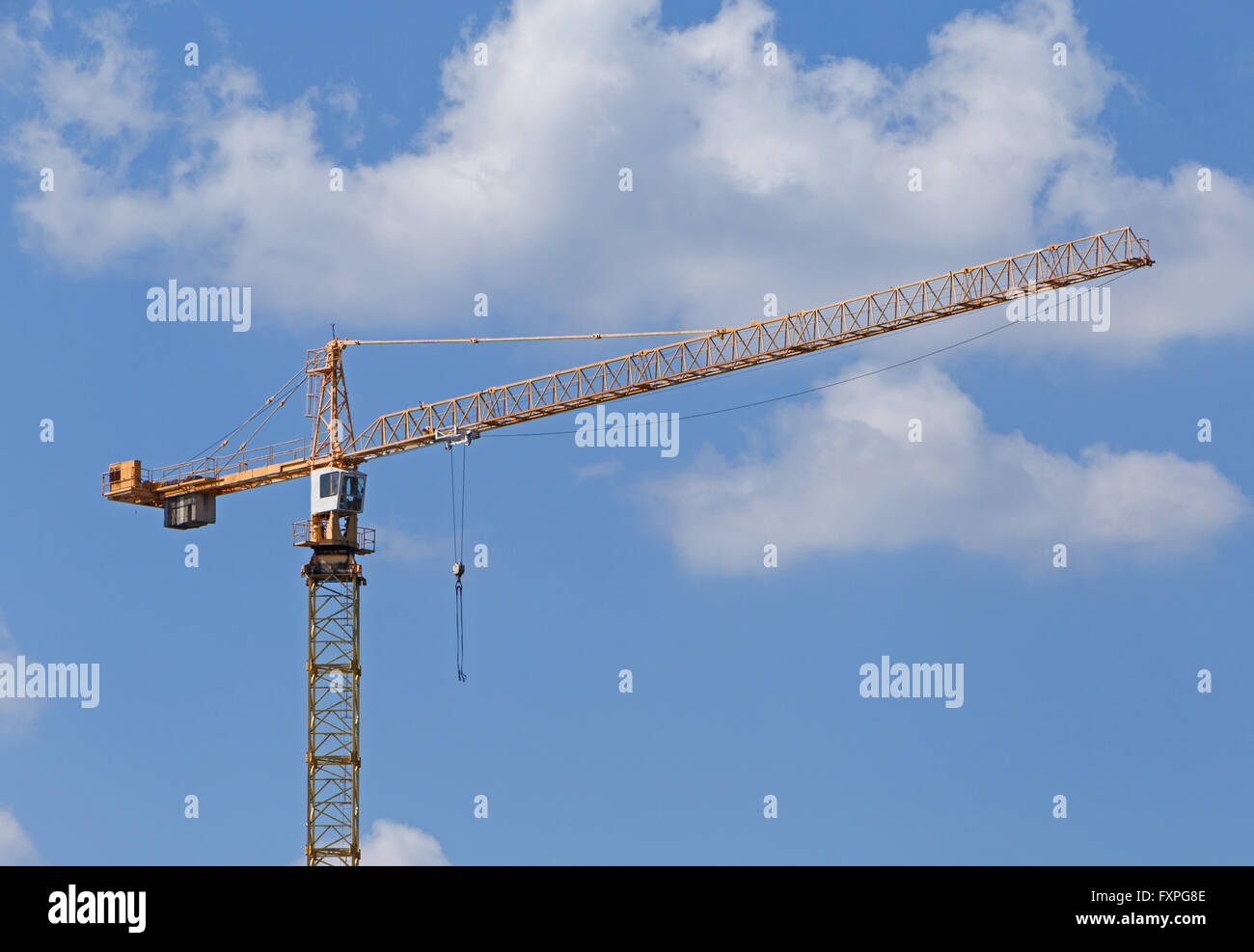 tower crane over blue sky with clouds Stock Photo