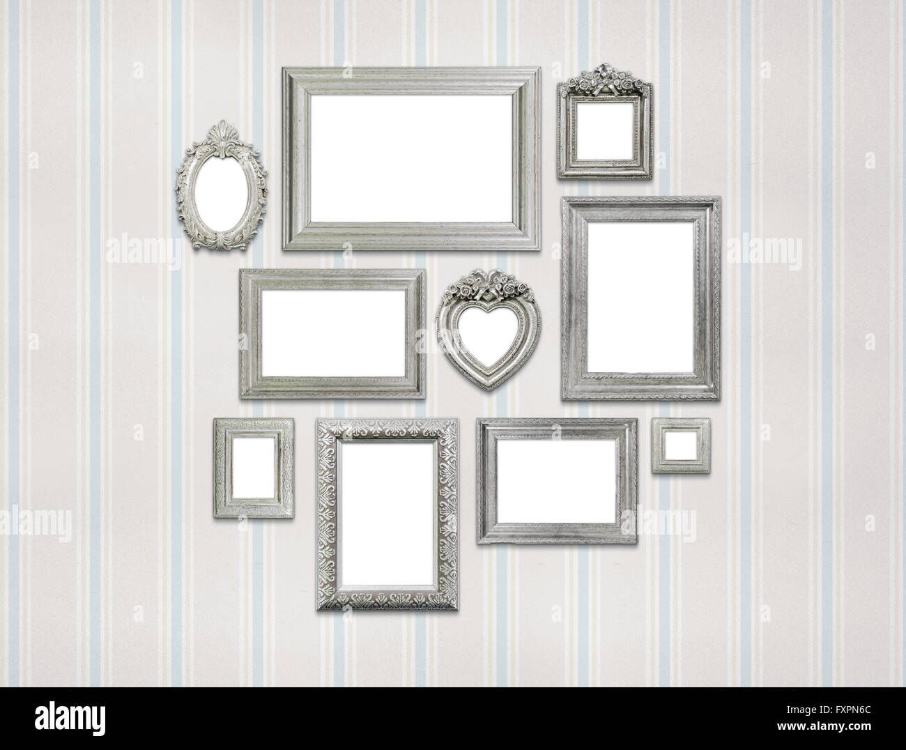 Empty picture frames on green wall Stock Photo