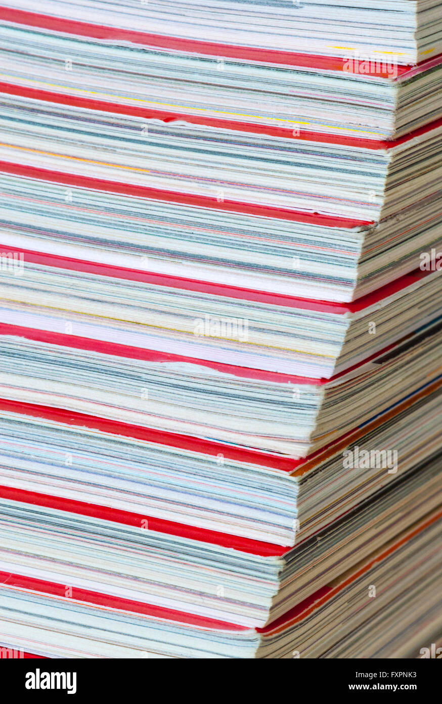 Stack of magazines with red cover Stock Photo - Alamy