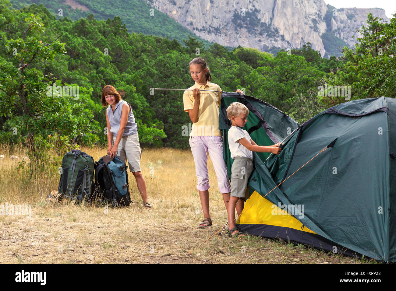 Family setting a tent Stock Photo