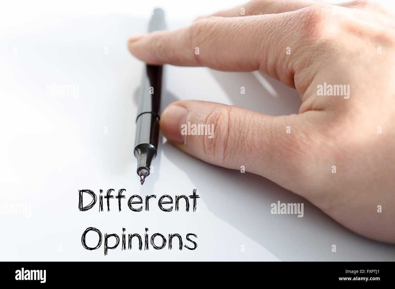 Different opinions note in business man hand Stock Photo