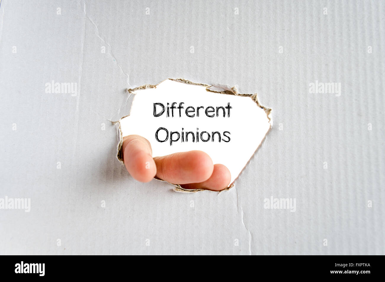 Different opinions note in business man hand Stock Photo