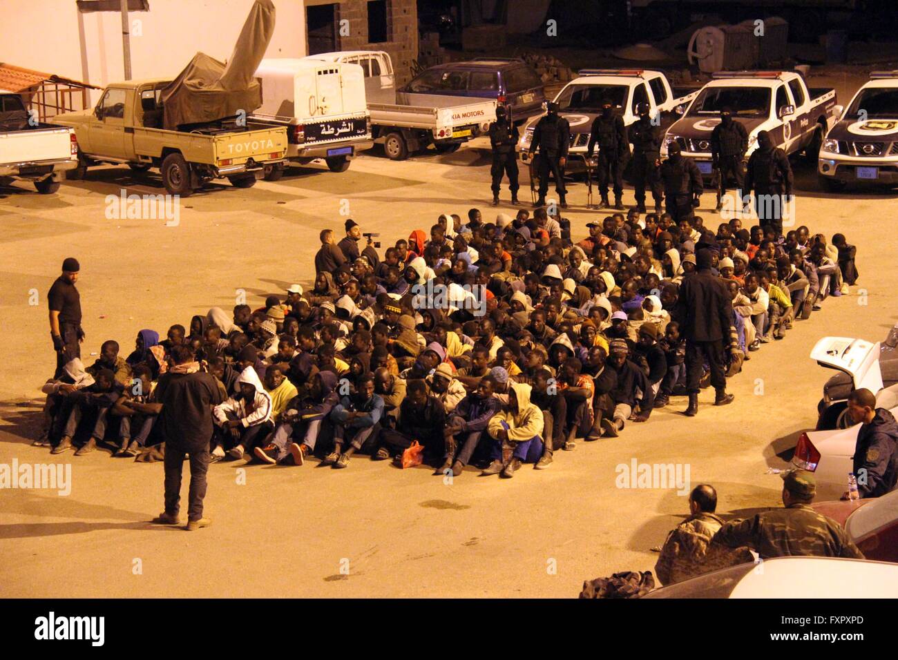 Tripoli, Libya. 17th Apr, 2016. Illegal migrants, who wanted to cross the Mediterranean to Europe, are detained by Libyan security forces during a raid in Tripoli, Libya, early April 17, 2016. © Hamza Turkia/Xinhua/Alamy Live News Stock Photo
