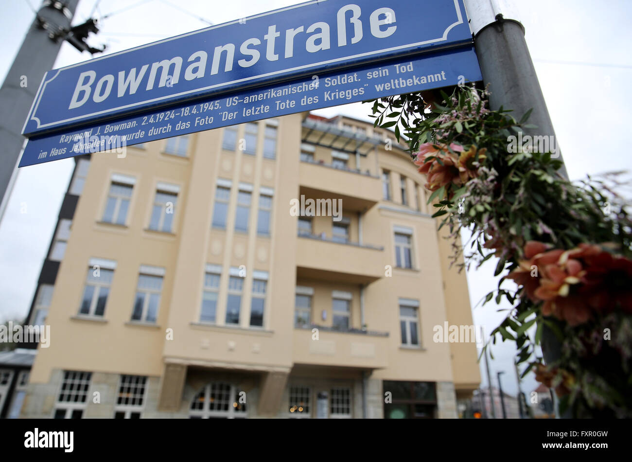 A sign for a street named after a dead US soldier named Bowman pictured in front of the Capa House in Leipzig, Germany, 17 April 2016. The building, now also known as Capa House, became famous internationally through the picture 'Last man to die' by US war photographer Robert Capa. He documented how US soldier Raymond J. Bowman was shot dead on the second floor balcony on 18 April 1945 as US forces liberated Leipzig. The building was overhauled after years of decay, with an exhibition now showcasing the history of the building. Photo: JAN WOITAS/dpa Stock Photo