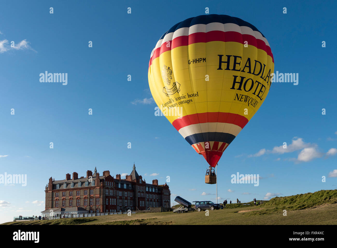 Headland Hotel, Newquay, Cornwall, 17th April 2016.   The spectacular launch of a colourful hot air balloon as it takes to the sky above the Headland Hotel in Newquay, Cornwall.  Photographer;  Gordon Scammell/Alamy Live News Stock Photo
