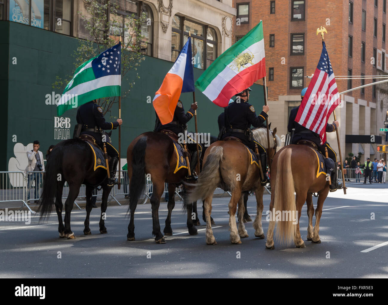 Mounted policemen on horses carrying flags in the 2016 Persian Parade, New york Stock Photo