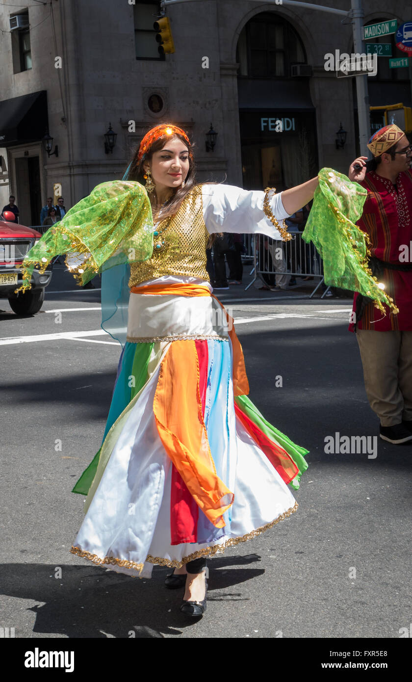 Young woman wearing traditional Iranian / Persian dress carrying ...