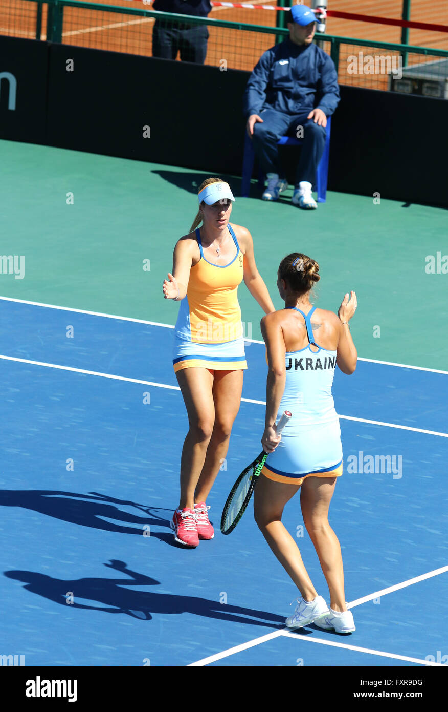 Kyiv, Ukraine. 17th April, 2016. Kateryna Bondarenko (R) and Olga Savchuk of Ukraine react during BNP Paribas FedCup match against Maria Irigoyen of Argentina at Campa Bucha Tennis Club in Kyiv, Ukraine. Credit:  Oleksandr Prykhodko/Alamy Live News Stock Photo
