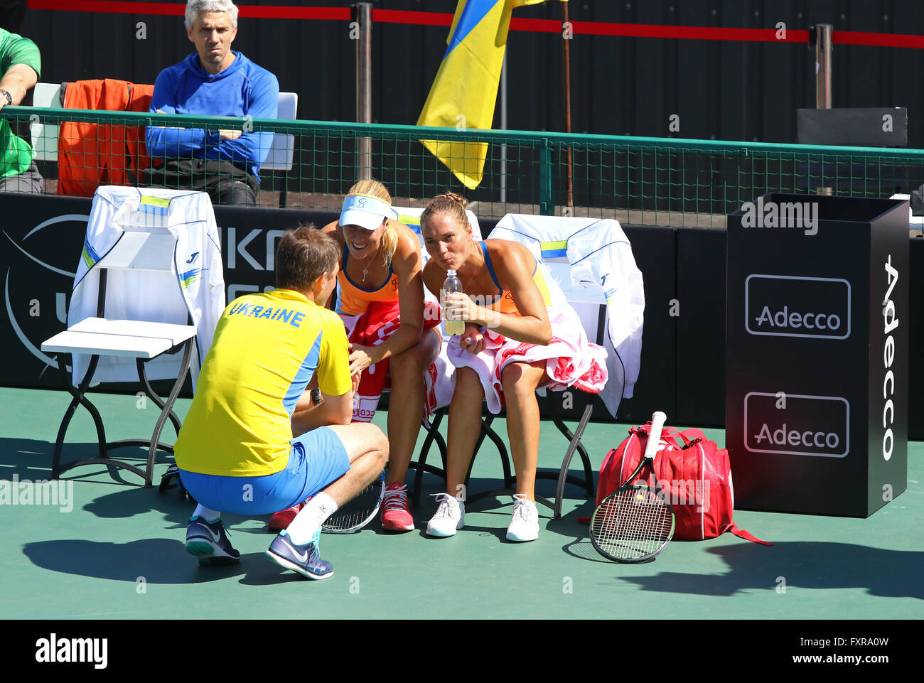 Kyiv, Ukraine. 17th April, 2016. Captain of Ukraine National Team Mikhail Filima (L) and players Kateryna Bondarenko and Olga Savchuk during BNP Paribas FedCup pair game Ukraine vs Argentina at Campa Bucha Tennis Club in Kyiv, Ukraine. Credit:  Oleksandr Prykhodko/Alamy Live News Stock Photo