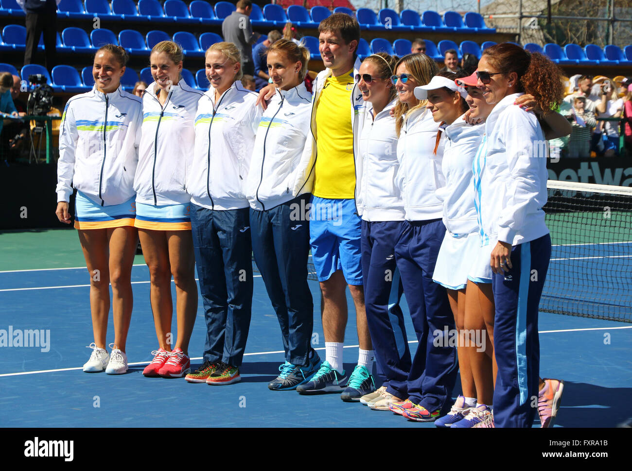 Kyiv, Ukraine. 17th April, 2016. Ukraine and Argentina National Teams pose for a group photo after BNP Paribas FedCup match against Argentina at Campa Bucha Tennis Club in Kyiv, Ukraine. Ukraine won 4-0 and entered the 2017 World Group II. Credit:  Oleksandr Prykhodko/Alamy Live News Stock Photo