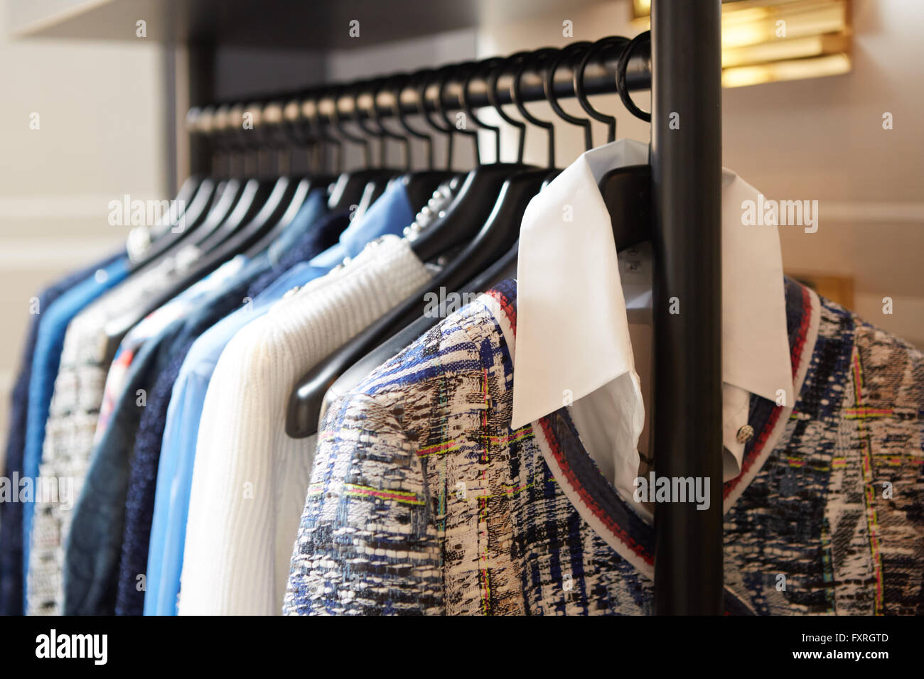 Clothes On Hangers In Shop Close Up Shallow Dof Stock Photo