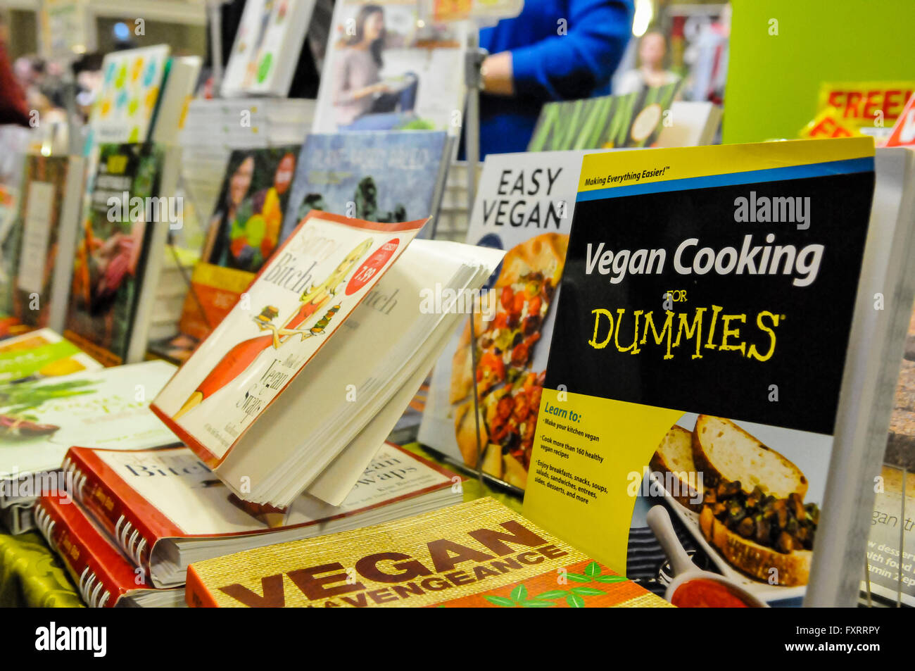 Vegan cookery books on sale at a market stall. Stock Photo