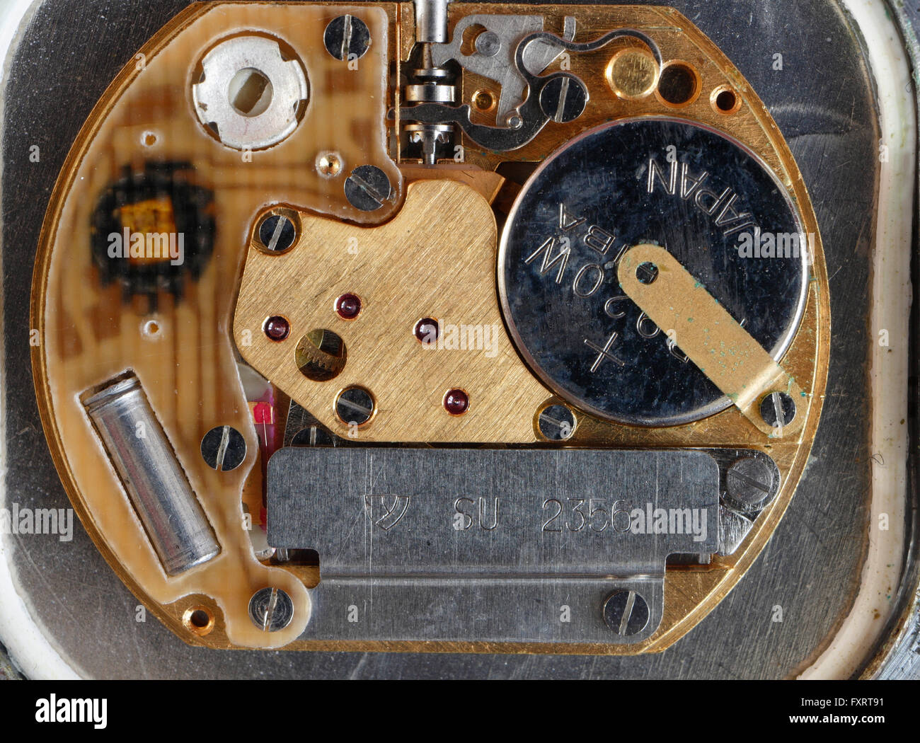 Macro image of electronic watch mechanism internal view battery Stock Photo