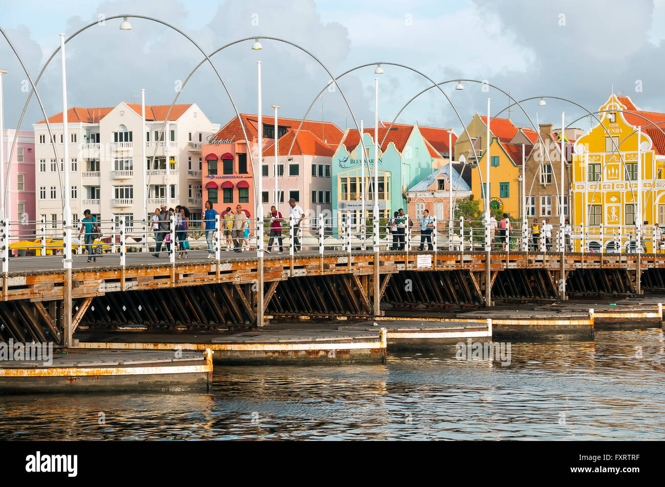 Queen Emma Bridge is a floating pontoon pedestrian bridge joining the Pinda and Otrabanda sides of Willemstad Curacao Stock Photo