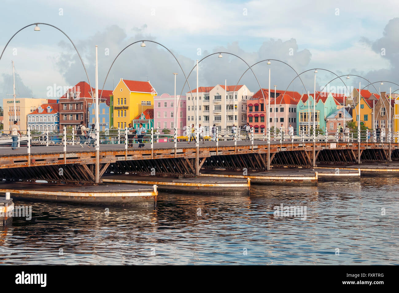 Queen Emma Bridge is a floating pontoon  pedestrian bridge joining the Pinda and Otrabanda sides of Willemstad Curacao Stock Photo