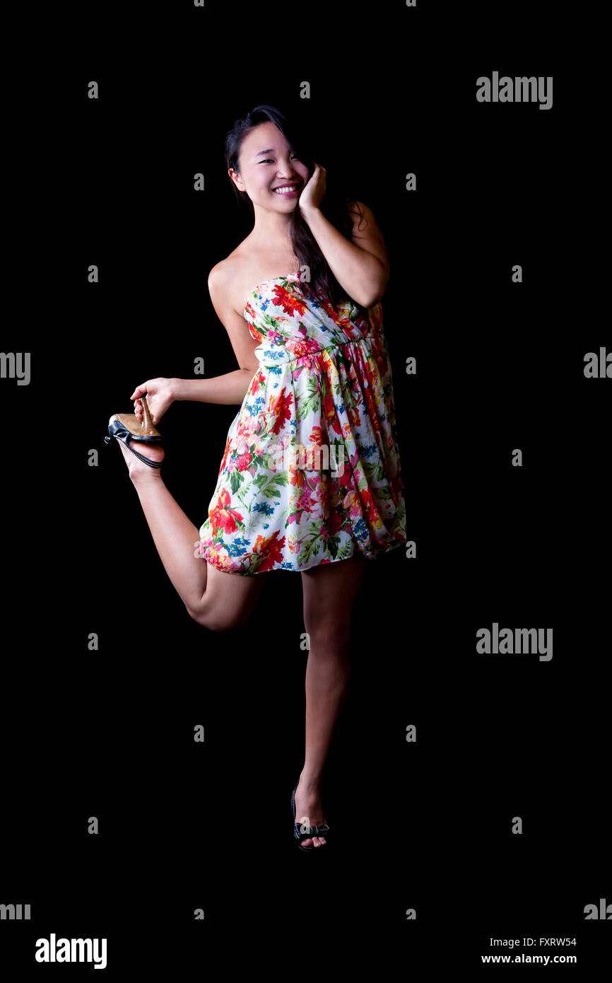 Young Asian American Woman Standing One Leg Stock Photo