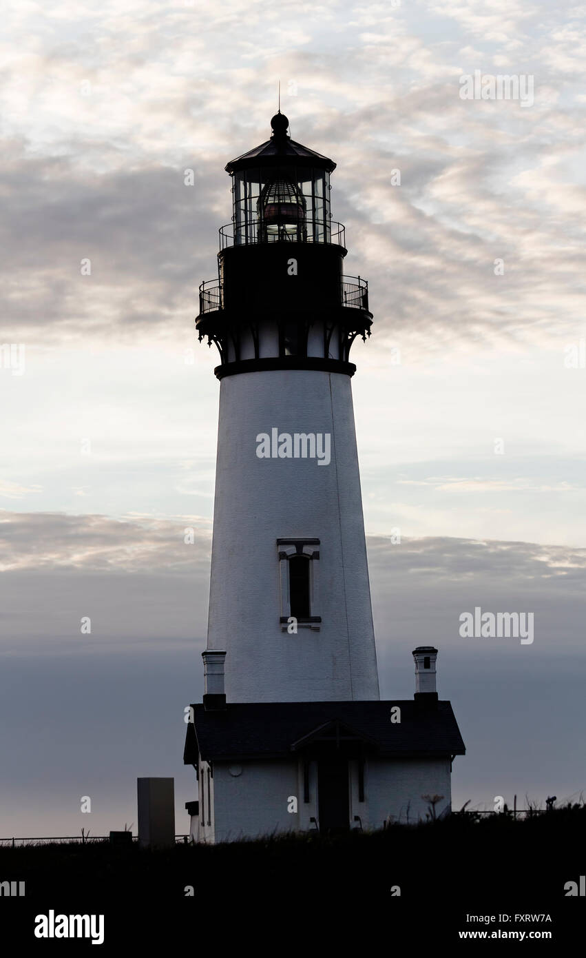 Vertical White Lighthouse Against Evening Cloudy Sky Newport Oregon Stock Photo
