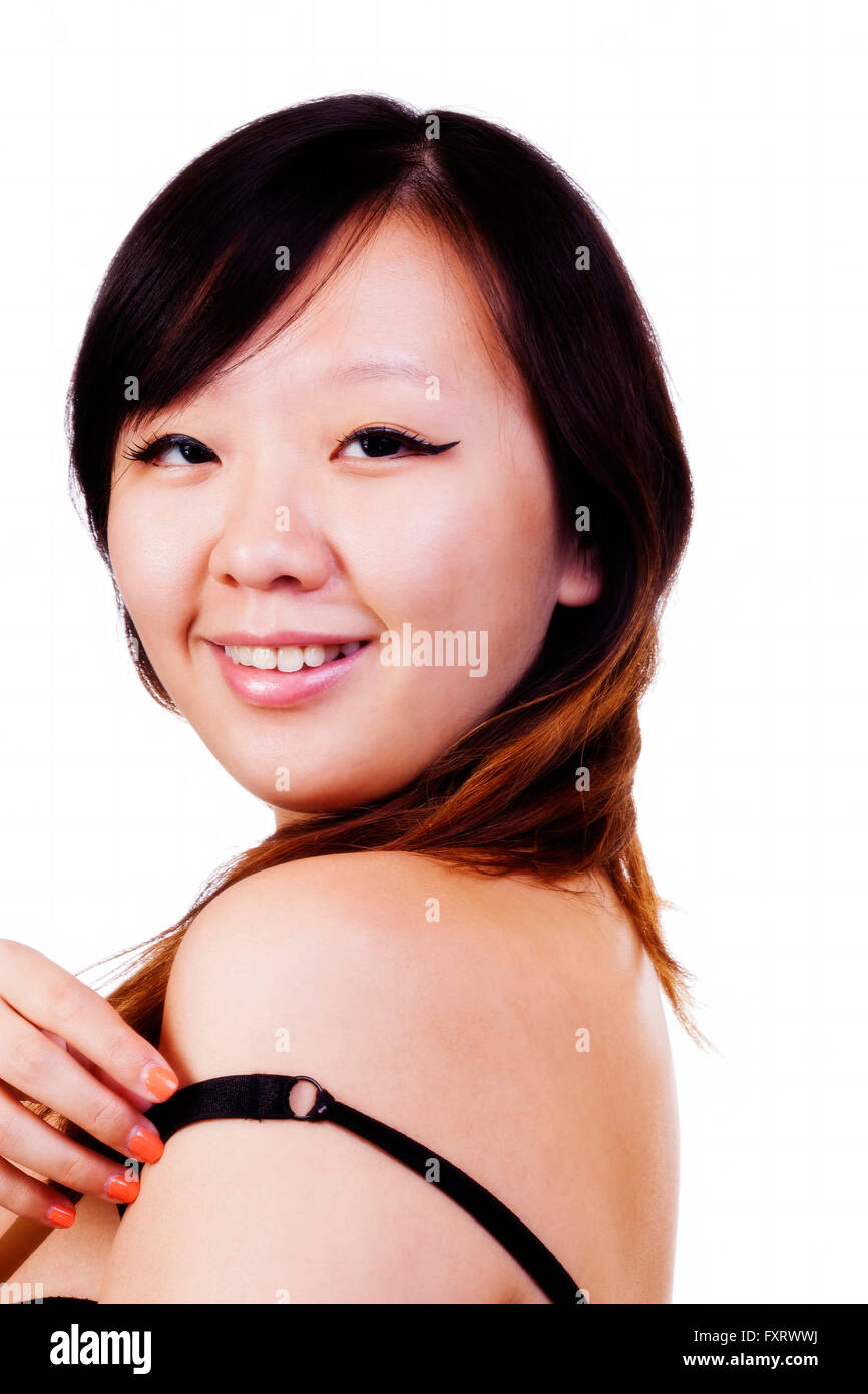 Portrait Asian American Woman Looking Over Bare Shoulder Stock Photo