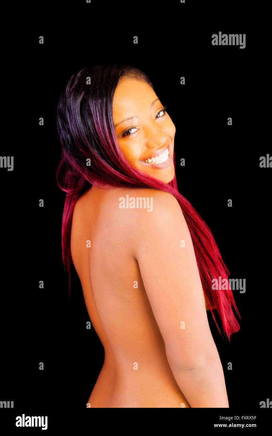Topless Black Woman From Back Smiling Over Shoulder Stock Photo