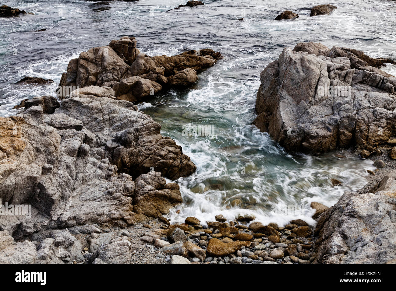 Ocean Water Between Rocks Beach Monterey California Stock Photo