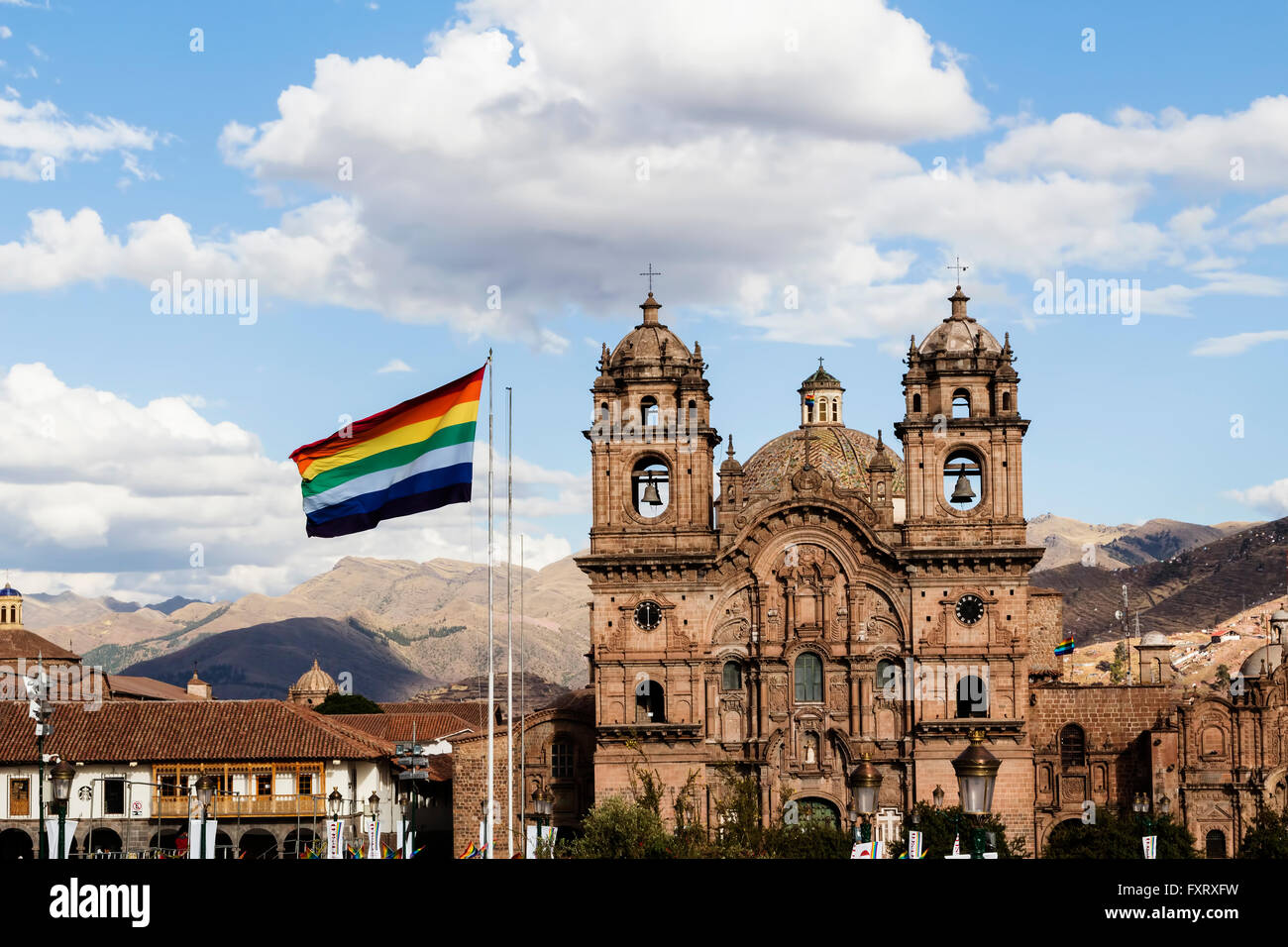 Cusco Flag With Compania De Jesus Church In Background Stock Photo