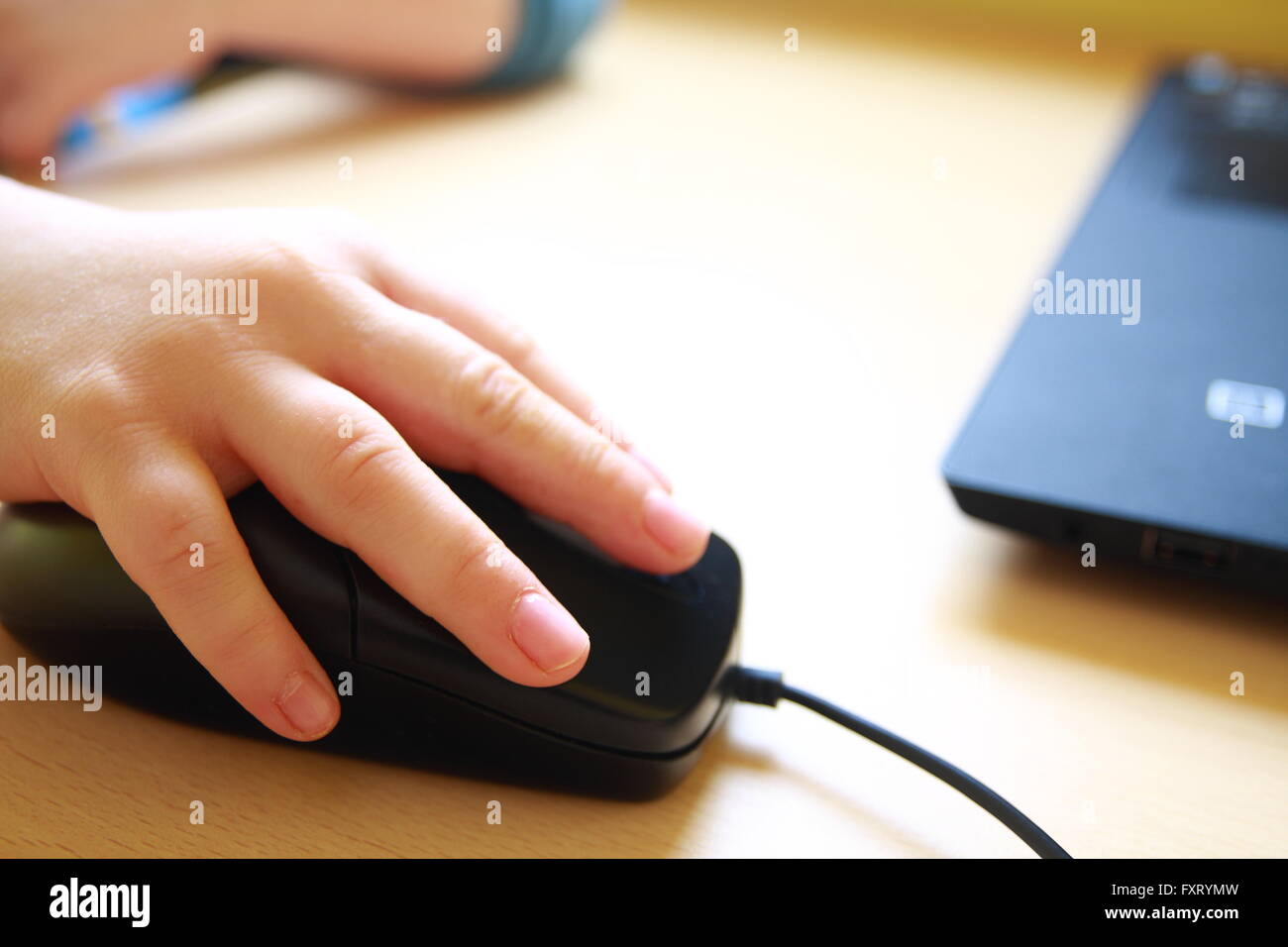 Child is using a computer mouse Stock Photo Alamy