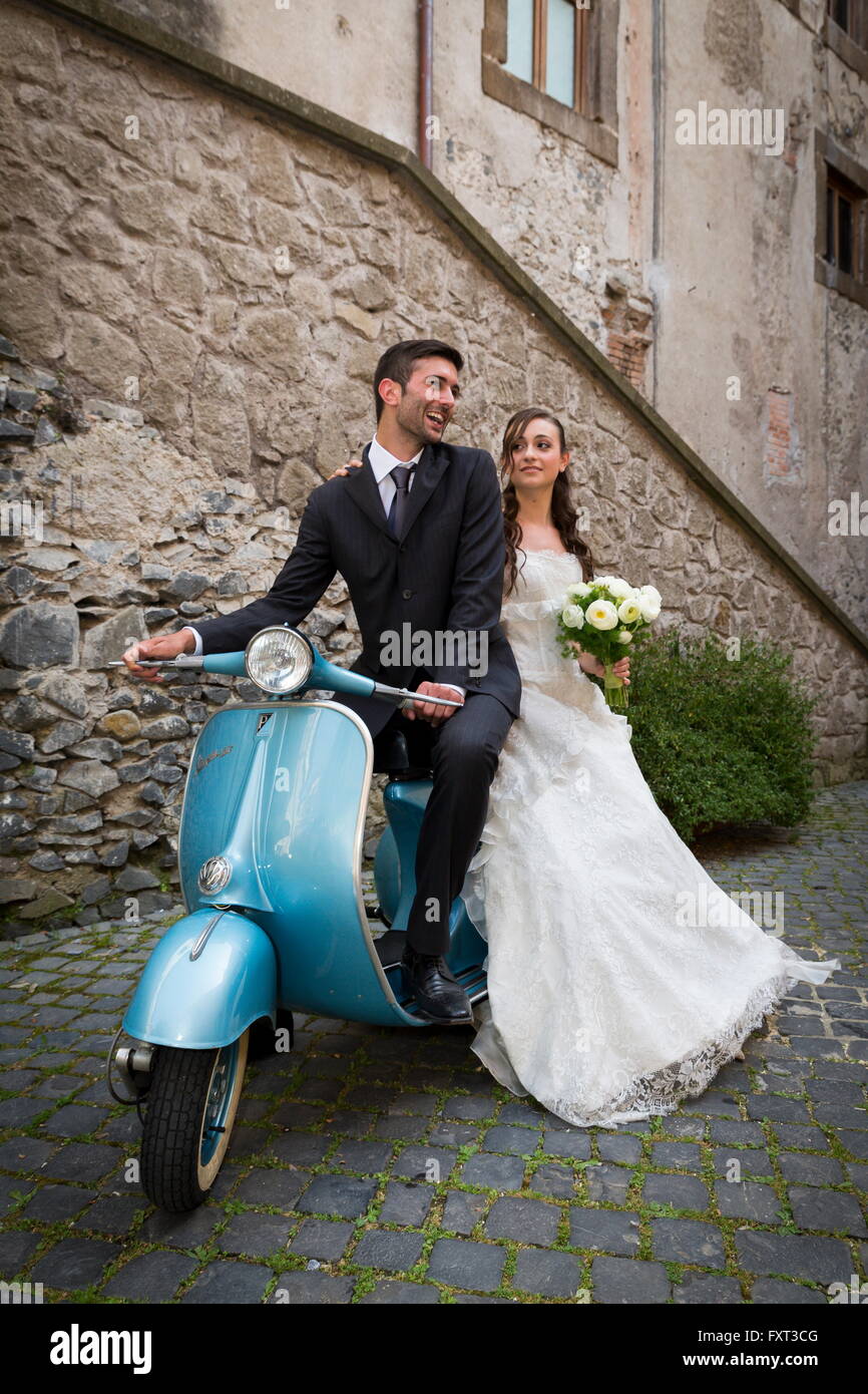 Bride and groom on a Vespa moped, Rome, Italy Stock Photo