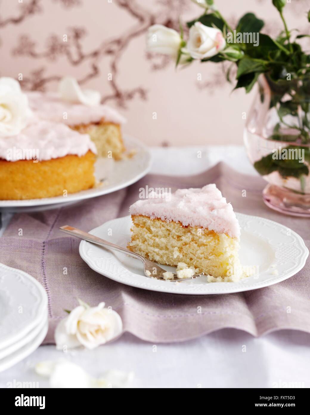 Coconut cake on traditional tea table Stock Photo