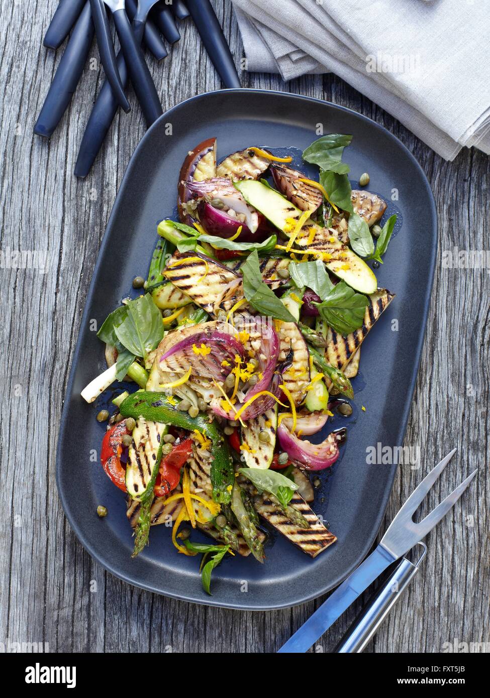 Overhead view of vegetable salad on barbecue griddle pan Stock Photo